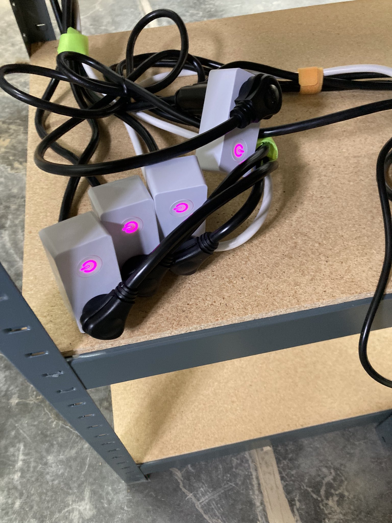 BN-Link smart plugs attached to UPS systems